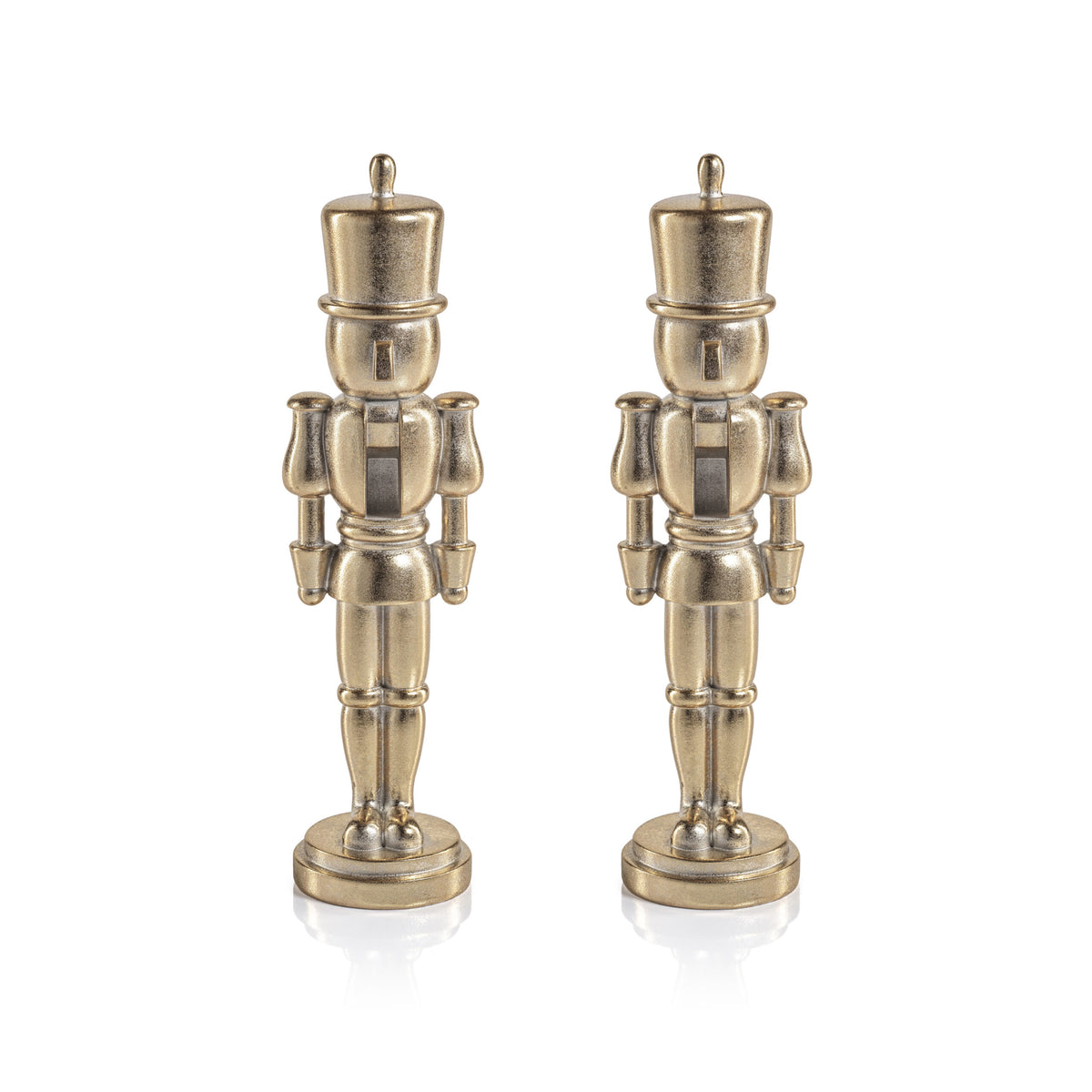 Two identical metallic Nutcracker Gold Statue figurines stand side by side.