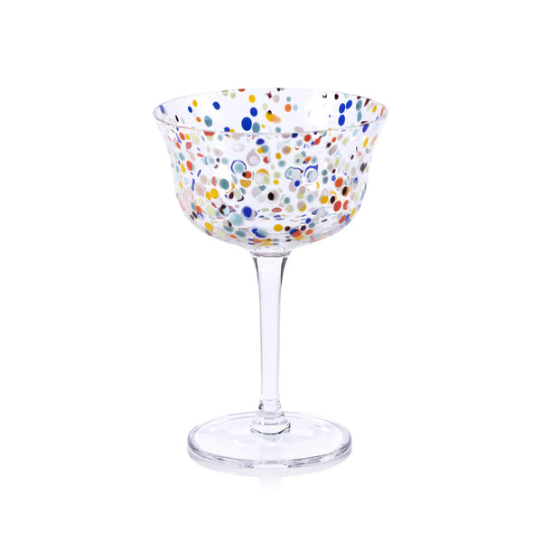 The Zodax Spritz Sprinkles Cocktail Glass features a wide bowl with vibrant blue, orange, green, red, and yellow polka dots on clear glass—perfect for brightening any festive table—with a transparent stem and base.