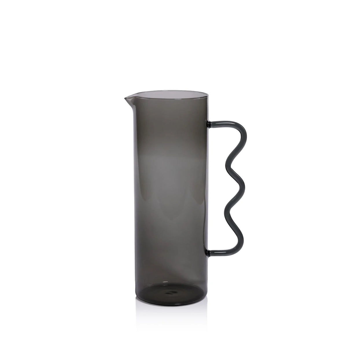 The Casa Smoke Pitcher by Zodax features a tall, cylindrical shape, narrow spout, and wavy handle. Its semi-transparent gray finish and modern design make it an eye-catching decor piece against any plain white backdrop.