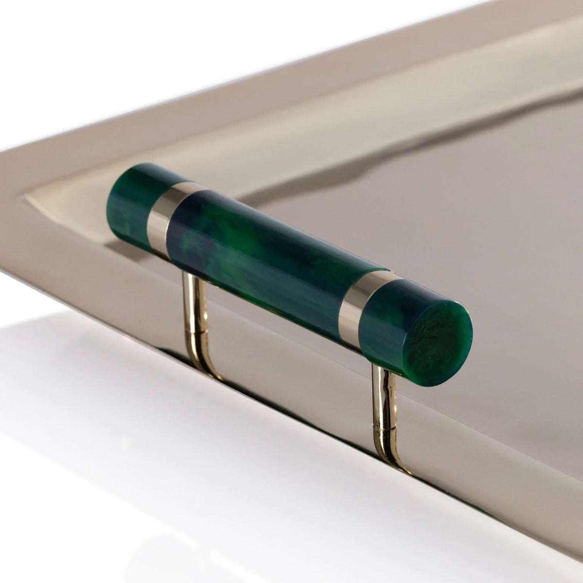 The Spector Serving Tray - Gold & Green by Zodax features a gold tray with a green cylindrical handle accented by two thin gold bands and gold supports, making it an elegant addition to your barware collection.