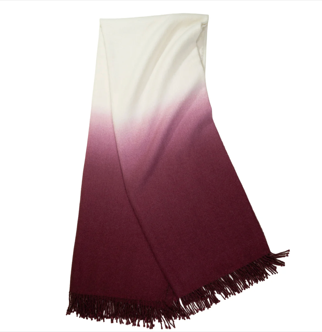 The Johanna Howard Dip Dye Throw features an elegant ombré fade from off-white to deep burgundy, finished with fringe along one edge.