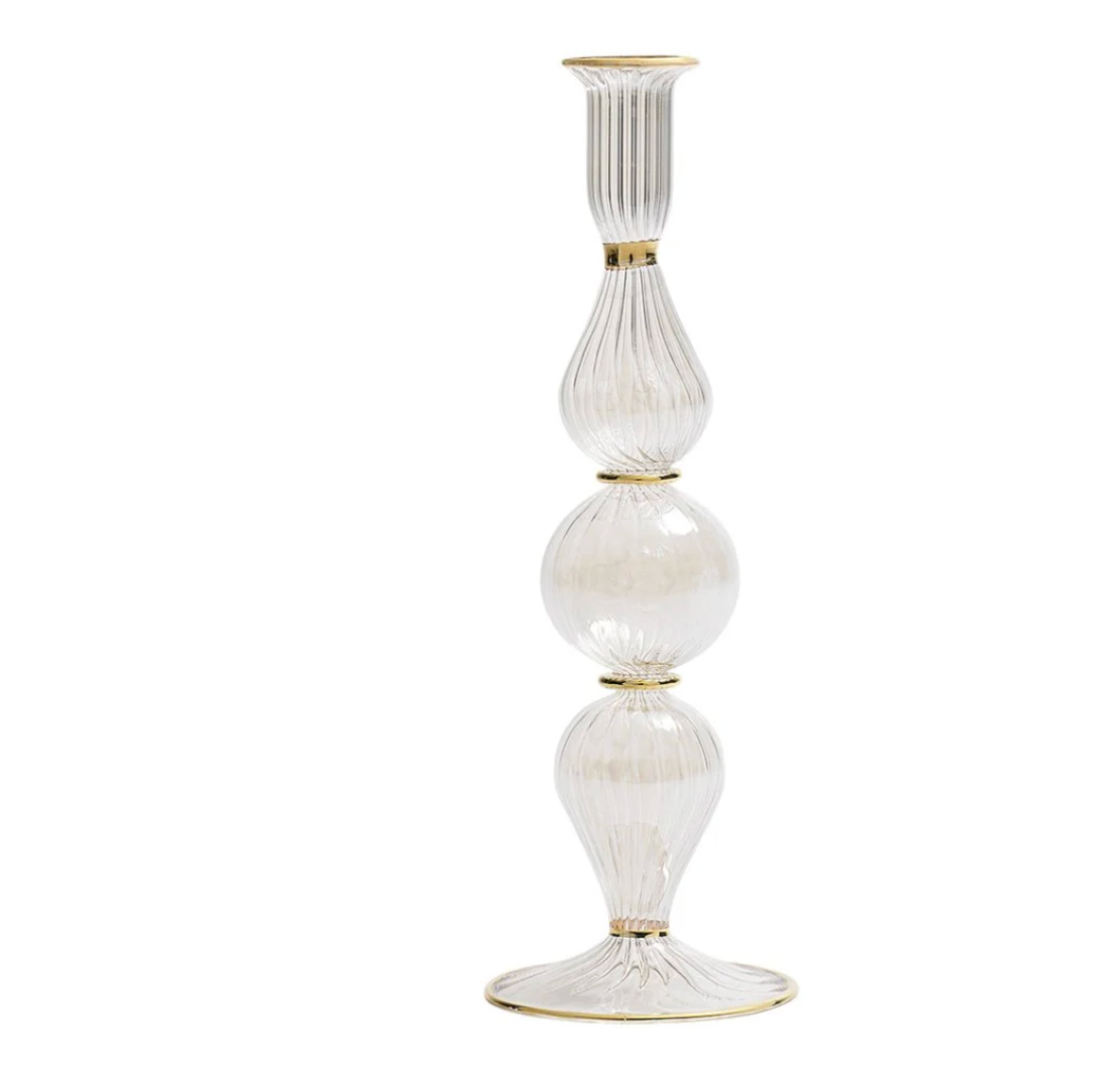 The Kim Seybert Ripple Candle Holder - Clear features stacked, ribbed, bulb-shaped sections with a flared circular base and elegant gold trim accents.