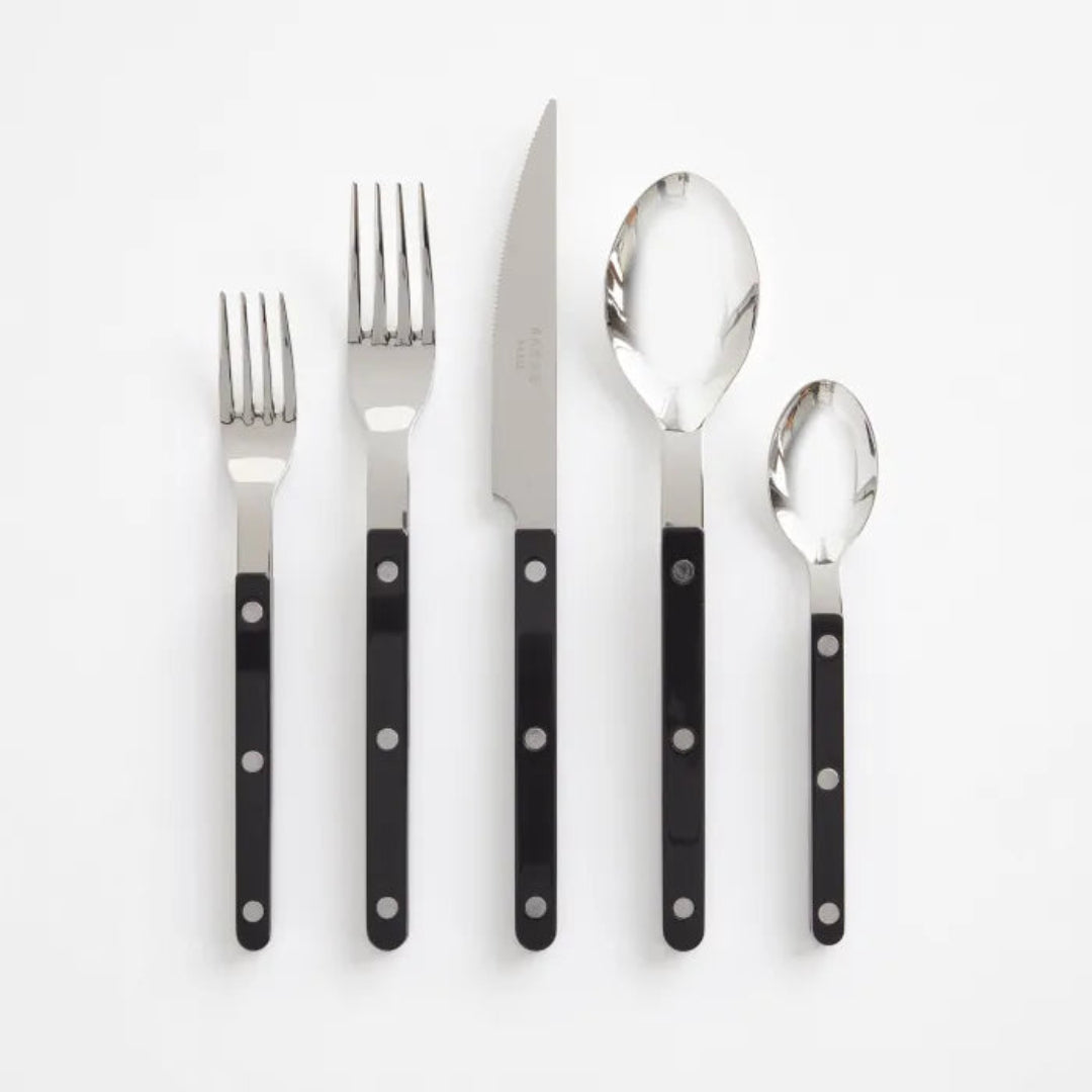 The Sabre Bistrot Solid Flatware 5 Piece Setting - Shiny features two forks, one knife, one tablespoon, and one teaspoon with black handles, arranged side by side on a white background.