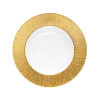 A round white plate from Haviland’s Infini Prestige Gold Dinnerware collection features a wide, textured gold rim with vertical lines radiating outward, crafted in Limoges porcelain and shown against a light background.