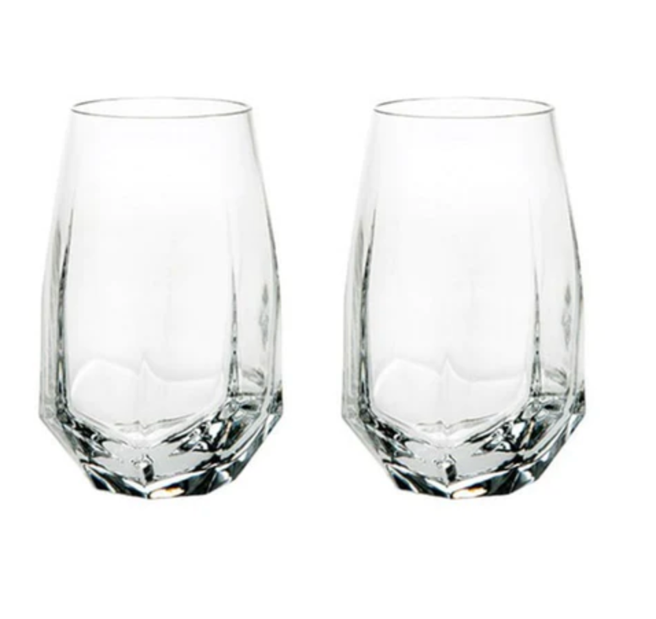 The Gemstone Highball Set of 2 by Vista Alegre features modern, geometric glasses with thick bases and faceted clear glass. Stylish and contemporary, these dishwasher-safe tumblers are perfect for any setting.