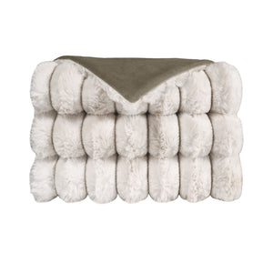 The Summit Throw by D.V. KAP / Canaan Company features a neatly folded, plush faux fur top and a smooth olive green underside, displayed against a plain white background.