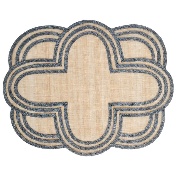 The Juliska Scallop Stripe Placemat features a beige center with an intricate blue border in an overlapping, scalloped quatrefoil pattern for a symmetrical, decorative look.