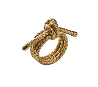 The Kim Seybert Rope Knot Napkin Ring Set of 4, featuring gold-colored braiding with metallic ends, brings a coastal touch to your table setting.