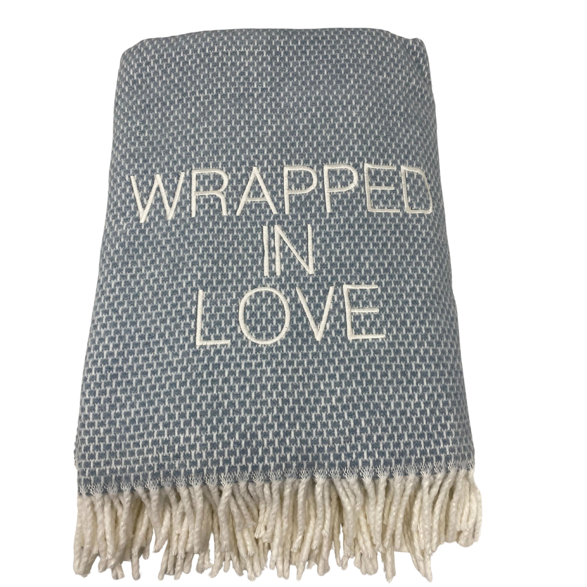 The A Soft Idea Wrapped in Love Throw is a super soft, gray woven blanket with white fringe and “WRAPPED IN LOVE” embroidered across the center. Machine washable, it makes the perfect holiday gift.