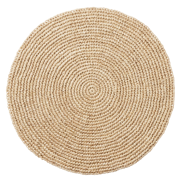 Emmy Round Placemat Set of 4 in natural, featuring a handmade round design of woven fibers in a spiral pattern.