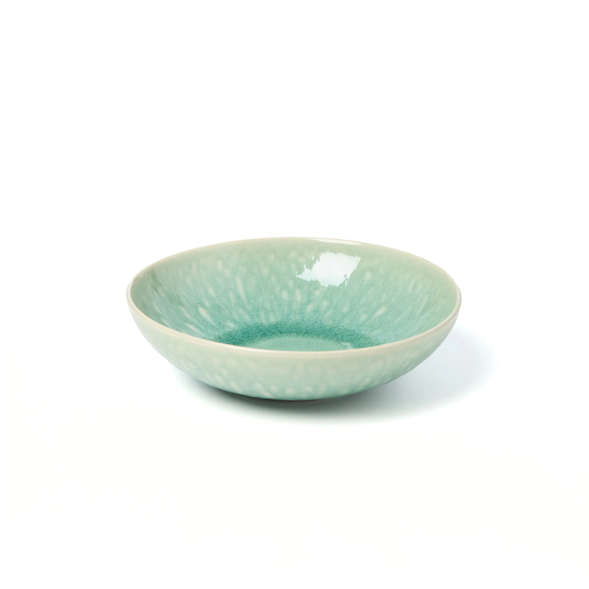 A shallow, round ceramic bowl in a soft jade green and white speckled glaze from the Jars - Rosenthal Tourron Dinnerware collection, shown on a plain white background.
