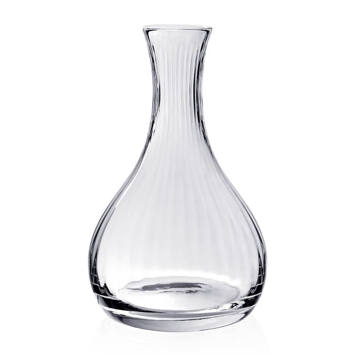 The William Yeoward Corinne Wine Carafe features handmade crystal glass with vertical ridges, a wide rounded base, and a flared neck. Made in England, it adds elegant texture and sophistication to entertaining.
