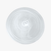 A close-up, top-down view shows a clear, circular piece from the Mariposa Swirl Alabaster Dinnerware White Set of 4 against a plain white background.