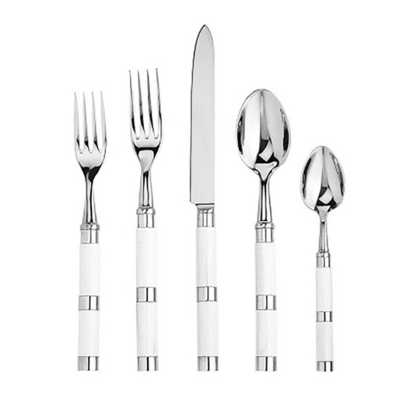 The Alain Saint-Joanis Carla Flatware 5 Piece Setting in white features two forks, a knife, a tablespoon, and a teaspoon with elegant white and silver handles, displayed side by side on a white background.