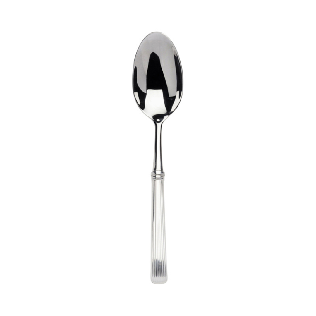 The Alain Saint-Joanis Beatrix Serving Spoon - Stainless features a reflective oval bowl and a textured handle, displayed against a plain white background.