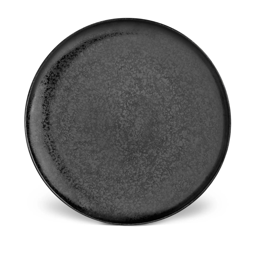 The Alchimie Dinnerware Black plate by L’Objet is a round, flat, dark gray ceramic piece with a subtly textured, speckled surface, photographed against a white background.