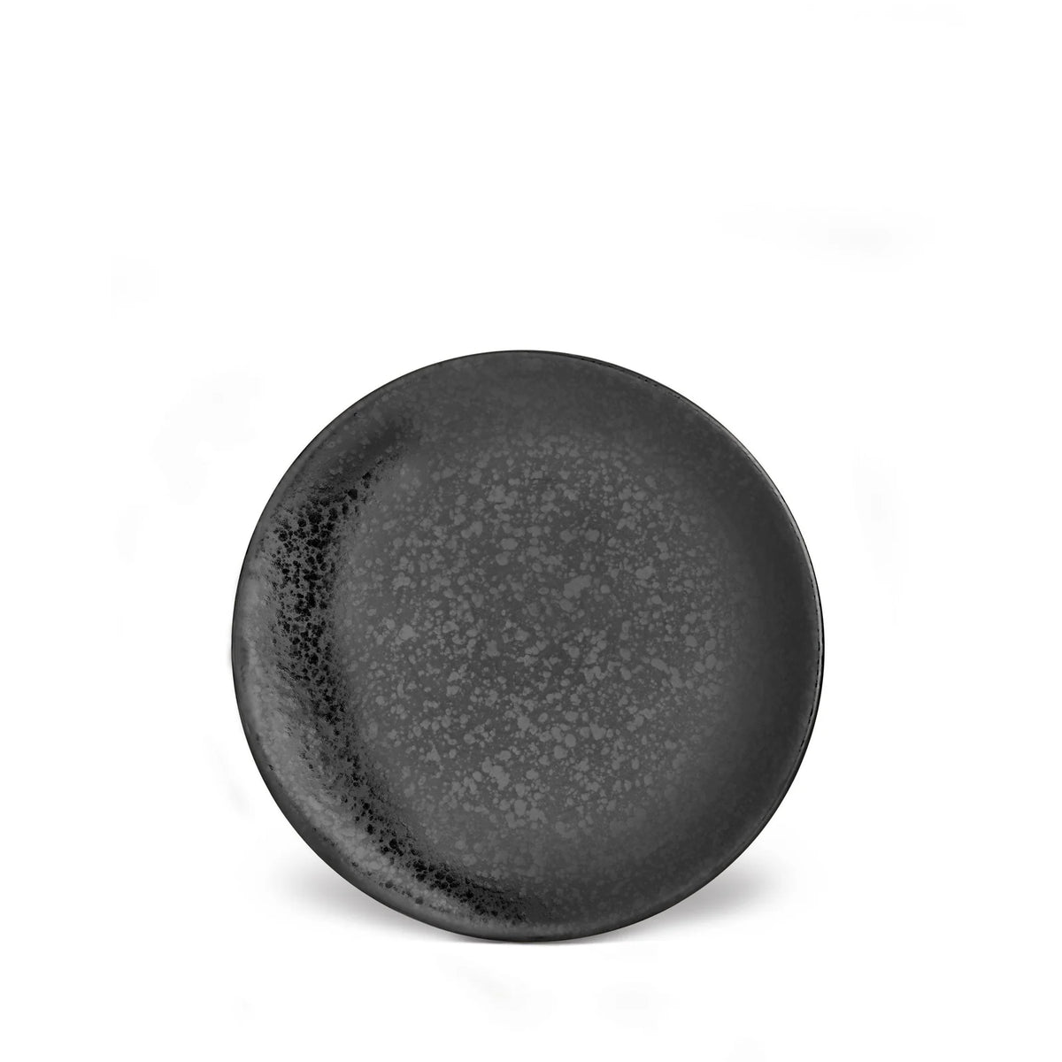 The Alchimie Dinnerware Black plate by L'Objet features a round, dark gray design with a speckled pattern and textured finish, shown on a white background—a striking piece of luxury tableware.