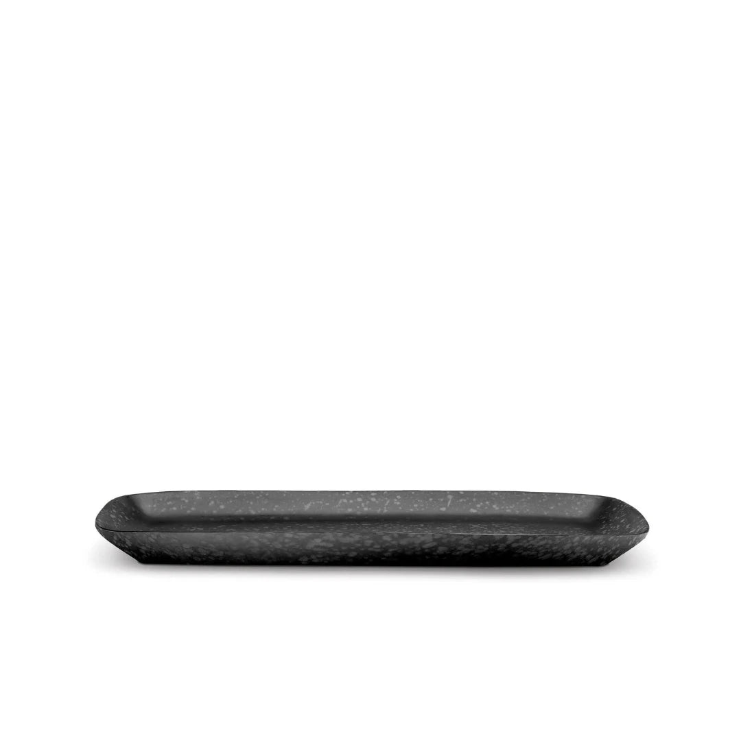The Alchimie Dinnerware Black tray by L'Objet is a rectangular, black piece with textured finish and slightly raised edges, shown against a white background.