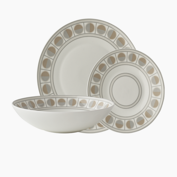The Greg Natale Amalfi Dinnerware 3 Piece Set features a large dinner plate, salad plate, and wide bowl in white bone china, each with a matching beige and gray geometric pattern inspired by circular designs near the rim.