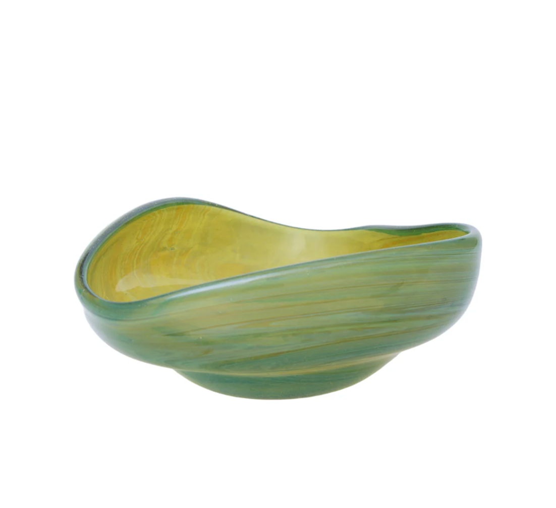 The Aura Small Catchall Bowl by Yakush is a small, asymmetrical green ceramic bowl with a smooth, glossy finish and rounded edges, perfect for holding jewelry. It is displayed against a plain white background.