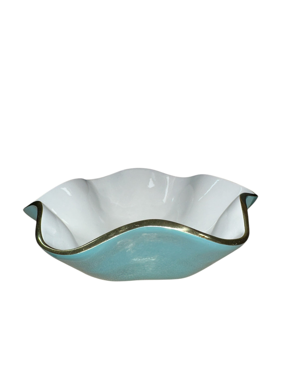 The Encanto Carola Bowl - Small by Beatriz Ball features white and light blue glass with a wavy ruffled edge and metallic trim, shown from the side against a white background.