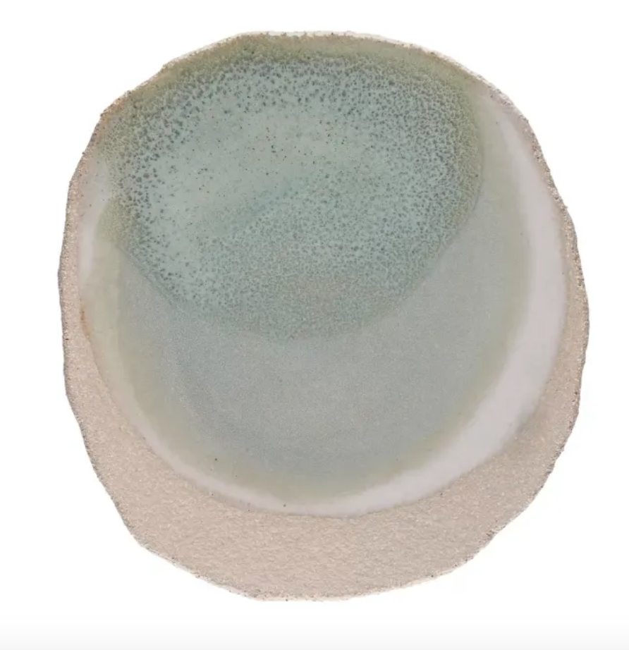 The Wabi Dinnerware Vert plate by Jars is a handmade round ceramic piece with a rough beige rim, glazed center in pale blue-green gradient, and speckled details—perfect for serving dessert with artisanal style.