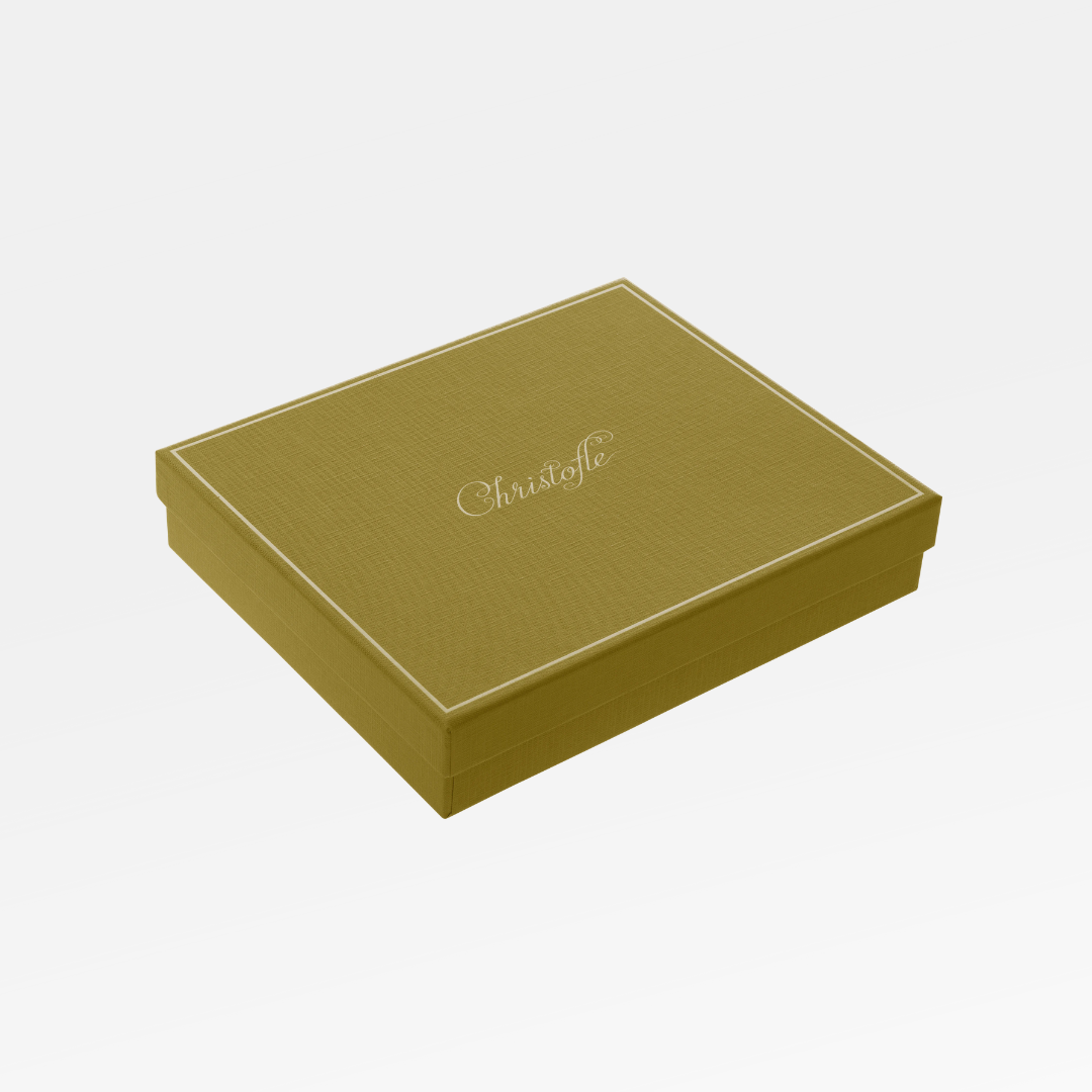 A rectangular, gold-colored gift box with Christofle script on the lid is perfect for presenting the Fidelio Christofle Silver Plated Frame 7x9.5 by Christofle, displayed against a plain white background.