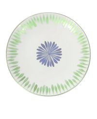 The Marie Daâge Marie Daage Allee de Cypres 4 plate is a round white Limoges porcelain piece adorned with a central blue radial flower and border of green leaf motifs, exemplifying exquisite luxury tableware.