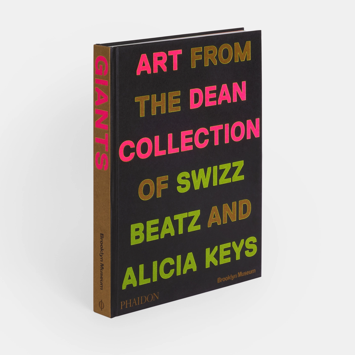 The hardcover book "Giants: Art from the Dean Collection" by Phaidon/Hachette features contemporary art, with colorful text on a black cover and brown spine.
