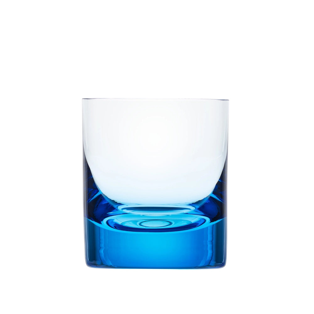 The Whiskey Set DOF Glass 370 ml by Moser is a clear tumbler with a thick, vibrant blue base, expertly crafted from lead-free crystal and displayed against a plain white background.