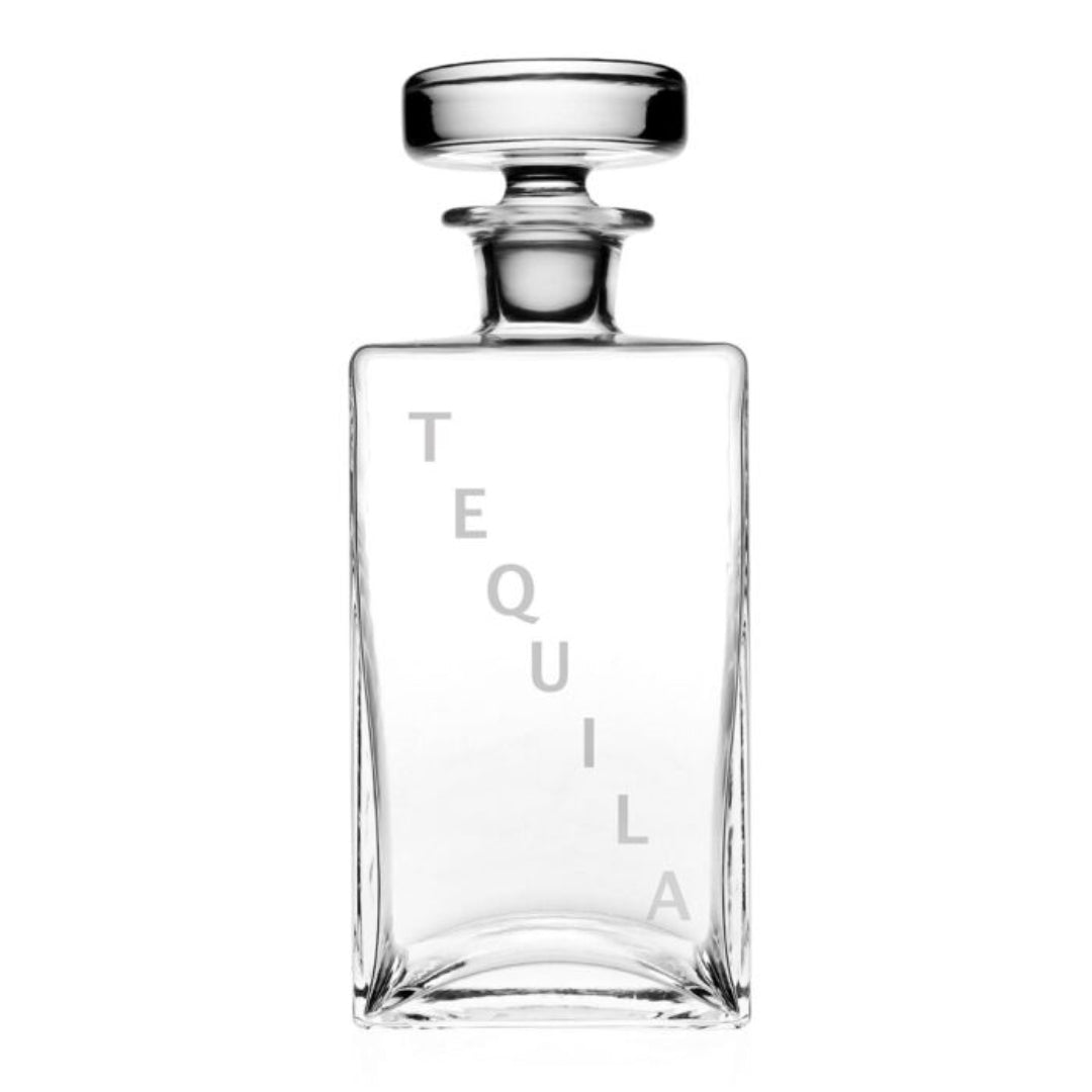 The William Yeoward Lillian Decanter Tequila is a clear, rectangular crystal decanter with a round stopper and "TEQUILA" in light gray on the front—an elegant tequila gift shown empty against a white background.