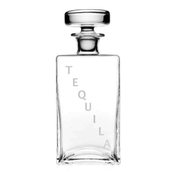 The William Yeoward Lillian Decanter Tequila is a clear, rectangular crystal decanter with a round stopper and "TEQUILA" in light gray on the front—an elegant tequila gift shown empty against a white background.