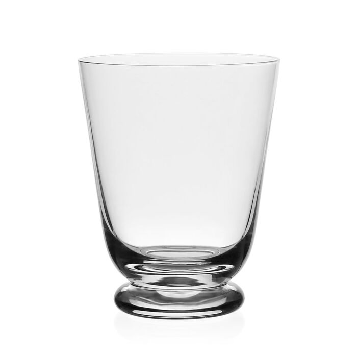 The William Yeoward Classic Footed Drinkware is a clear highball glass tumbler with smooth, straight sides and a slightly rounded base, shown against a white background. This stylish glass is also dishwasher safe for your convenience.