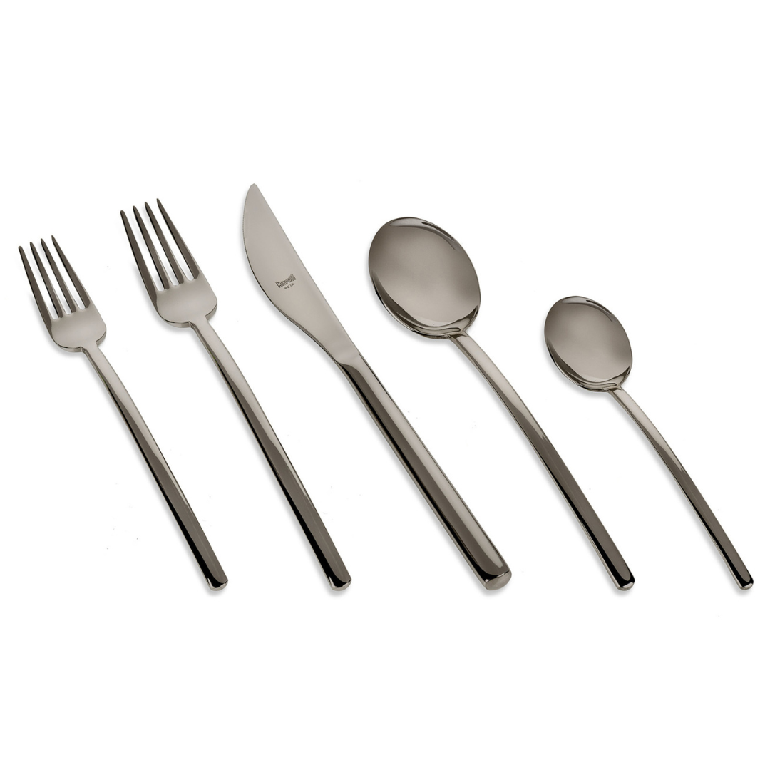 The Mepra Due Flatware 5 Piece Setting - Oro Nero features two forks, a knife, a large spoon, and a small spoon with a modern, shiny finish displayed in a row on a white background.