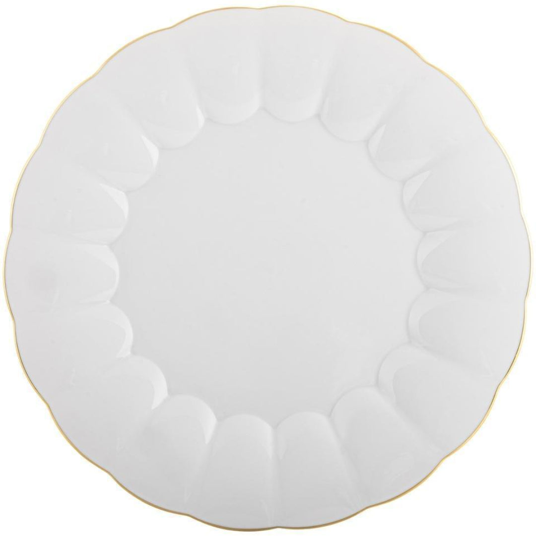 The Vista Alegre 200 Anos Dinnerware features a white, round ceramic plate with scalloped edges and a thin hand-painted gold rim, highlighting modern elegance in an overhead photo on a plain background.