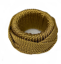 Four thick, coiled golden Rope Napkin Rings from Von Gern Home are neatly wound into circular shapes on a white background, each piece adding a touch of sophistication to any elegant table setting.