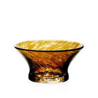 The Vanessa Tortoise Bowl by William Yeoward features marbled amber and brown tones and a wide, flared rim with a narrow base. Displayed against a white background, it is part of the Vases and Bowls collection.