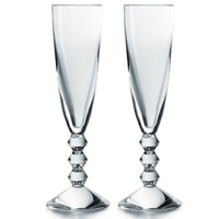 The Baccarat Vega Champagne Flute Set of 2 features clear crystal glasses with tall, faceted stems and geometric detailing—an elegant French-made pair, perfect for gifting in a luxury box.