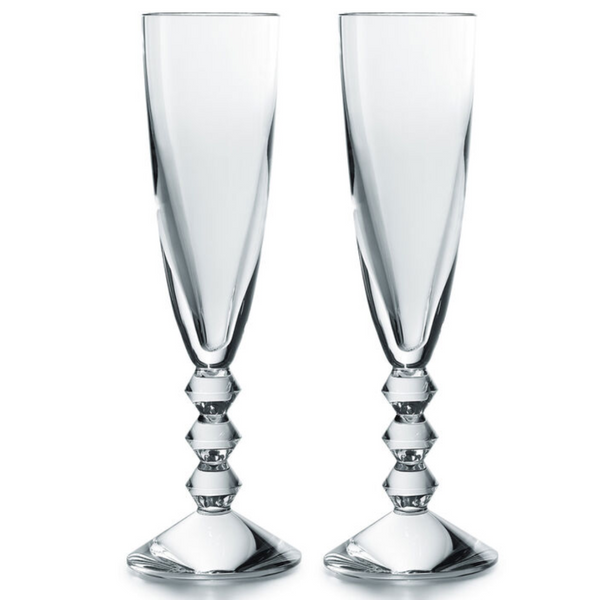 The Baccarat Vega Champagne Flute Set of 2 features clear crystal glasses with tall, faceted stems and geometric detailing—an elegant French-made pair, perfect for gifting in a luxury box.
