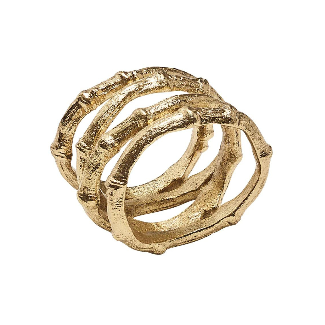 The Kim Seybert Bamboo Napkin Ring Gold Set of 4 features three textured, interwoven bands with a faux bamboo design—an elegant gold accent for your table setting.