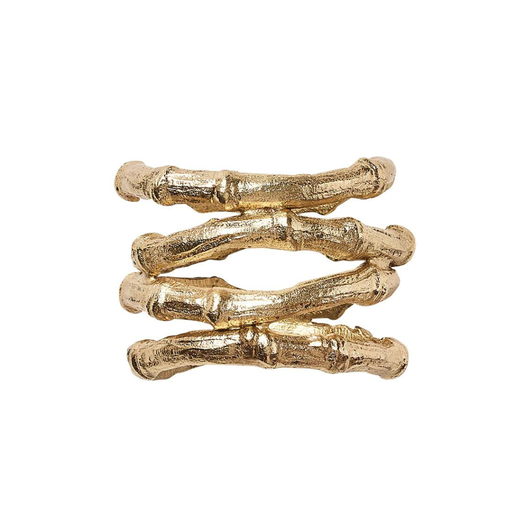 The Kim Seybert Bamboo Napkin Ring Gold Set of 4 features gold-plated rings designed to resemble three textured faux bamboo stalks stacked together, each with a detailed, organic finish.