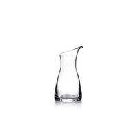 The Simon Pearce Barre Carafe features a slightly tapered neck and curved spout; this modern tabletop pitcher is shown against a white background.