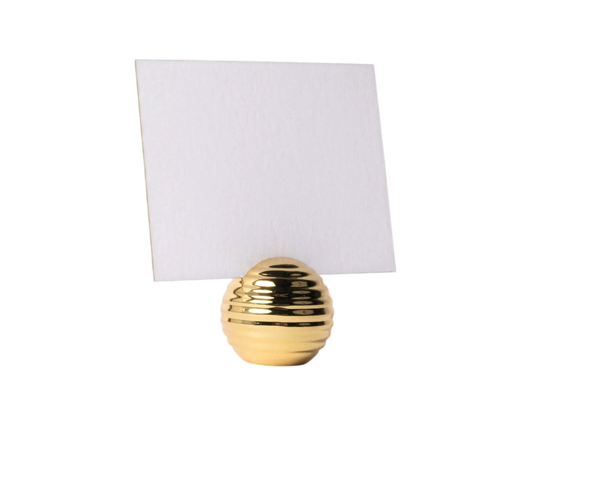 The Dear Annabelle Goldie Place Card Holder Set of 6, featuring gold beehive-inspired holders with weighted orbs, elegantly displays blank white cards upright—ideal for sophisticated table settings.