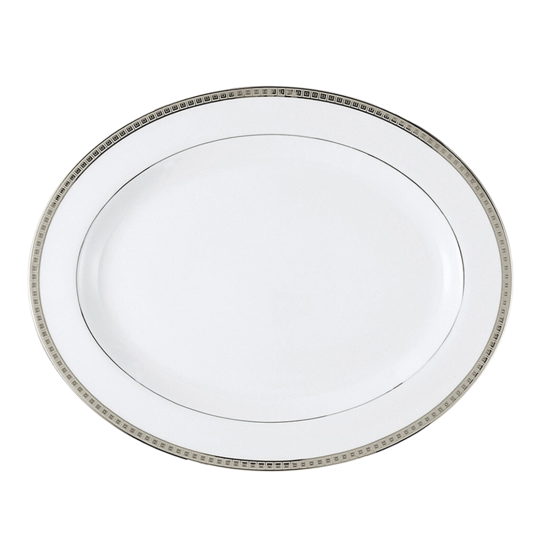The Bernardaud Athena Platinum Dinnerware features a white oval plate with a silver and black decorative border, shown against a plain white background.