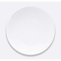 The Bernardaud Organza White Dinnerware is a ceramic dinner plate featuring a textured, woven pattern—perfect for minimalist interior décor.
