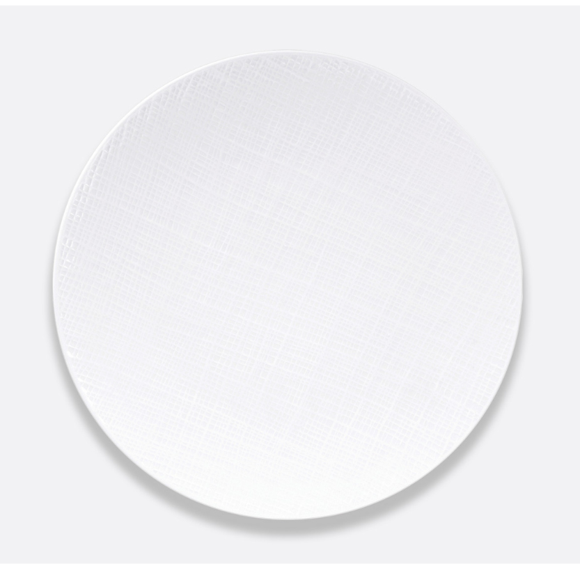 The Bernardaud Organza White Dinnerware, a round ceramic plate with a subtle textured pattern, is shown on a light gray background—ideal for minimalist interiors.