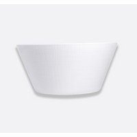 The Organza White Dinnerware by Bernardaud is a white, textured, round bowl with slightly flared sides set against a light gray background—ideal for minimalist interiors.