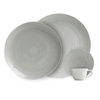A set of four grey Bernardaud Origine Dinnerware pieces, including two dinner plates, one small plate, and a matching cup—all crafted from Limoges porcelain with a subtle circular textured pattern.