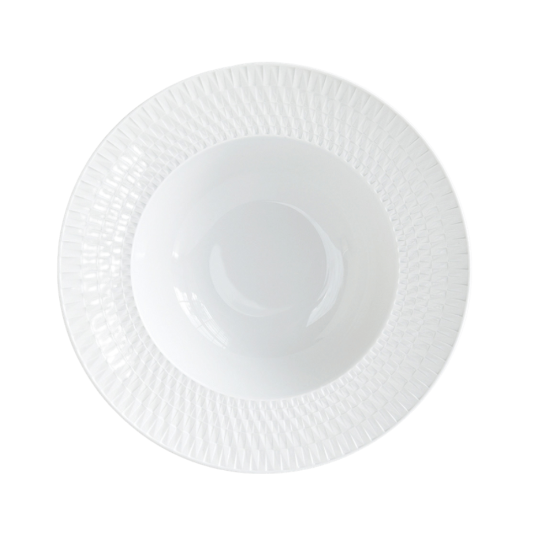 The Bernardaud Twist White Dinnerware features a white, round plate with a textured, geometric-patterned rim, photographed from above on a white background.