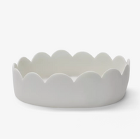 The Tina Frey Fleur Oval Bowl in white, a ceramic baking dish with scalloped, wavy edges, is shown on a plain white background.